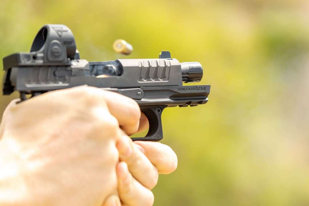 Staccato pistol being fired at an outdoor range