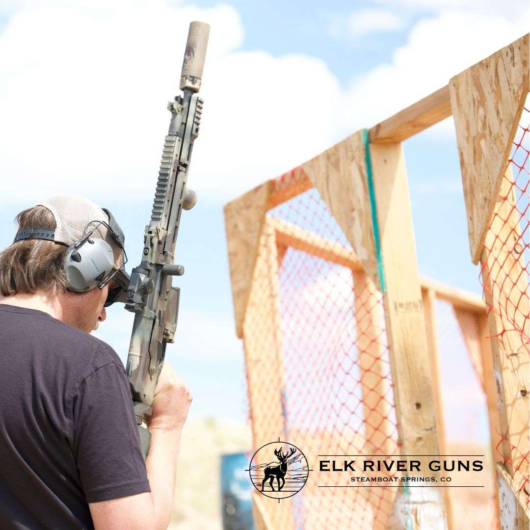 Guides Shooter with a semi-automatic rifle at a range barricade